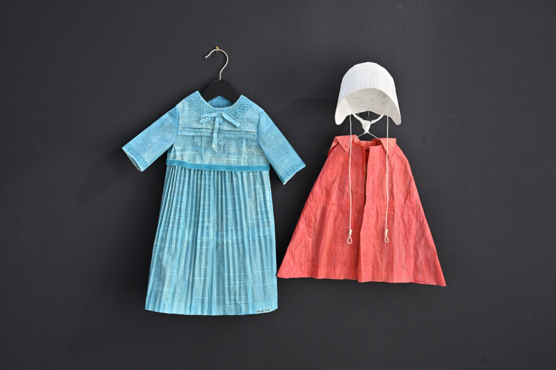 Art exhibit at Lawrence library features children’s garments made from banned books